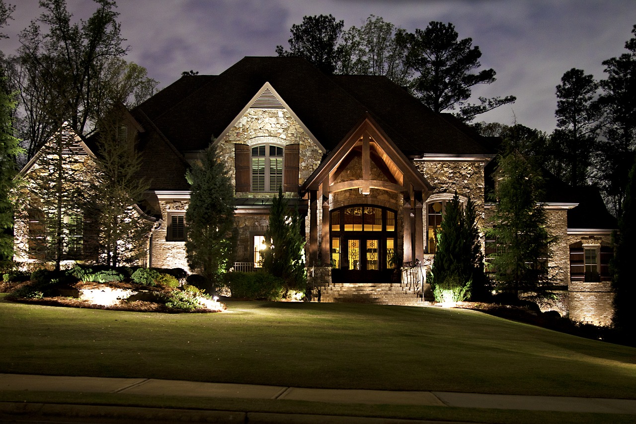 Home with outdoor landscape lighting