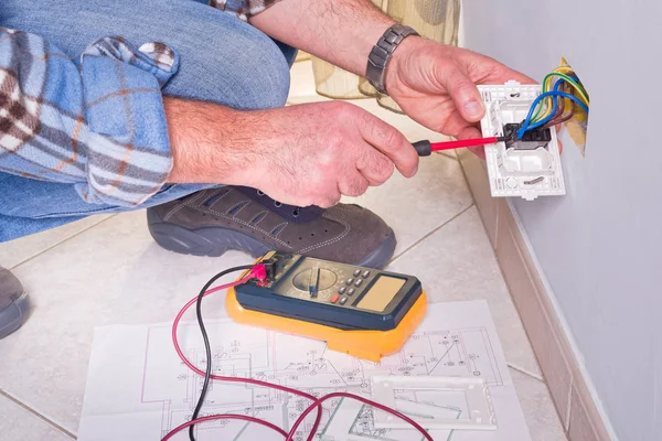 Electrician performing diagnostic testing