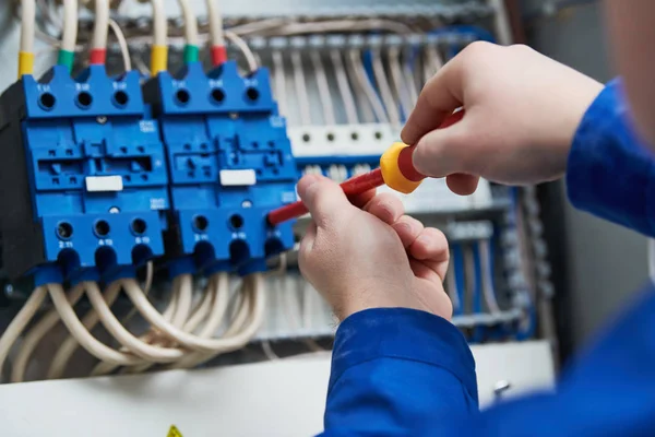 Electrician upgrading electrical panel